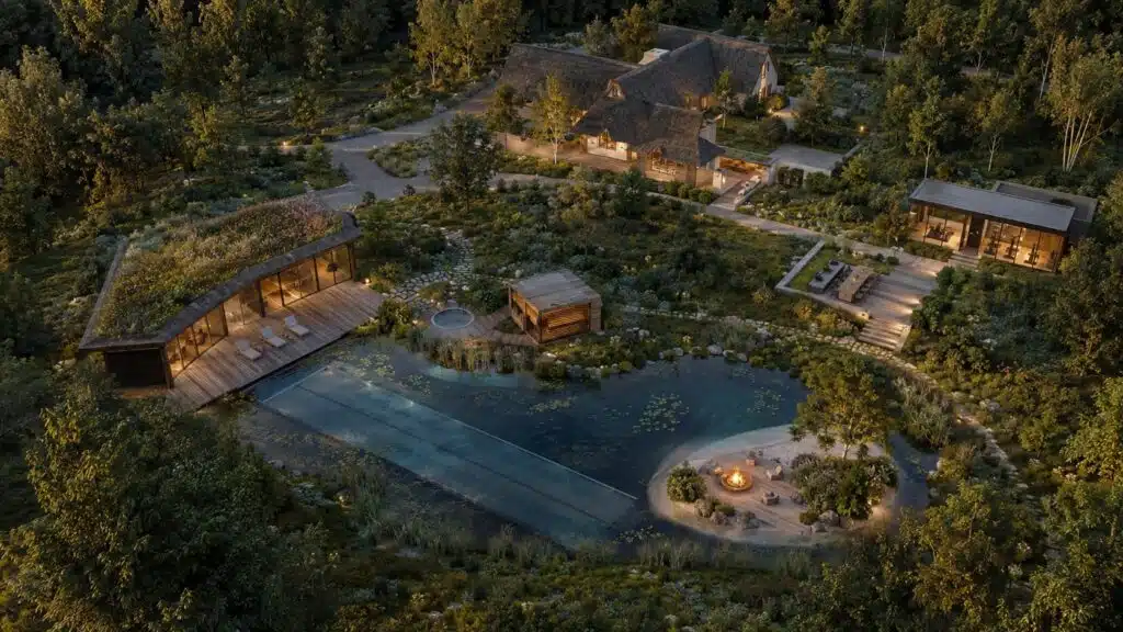 Luchtbeeld van een wellnesslandgoed met woning, paviljoens, zwemvijver, vuurplaats en wandelpaden in het groen